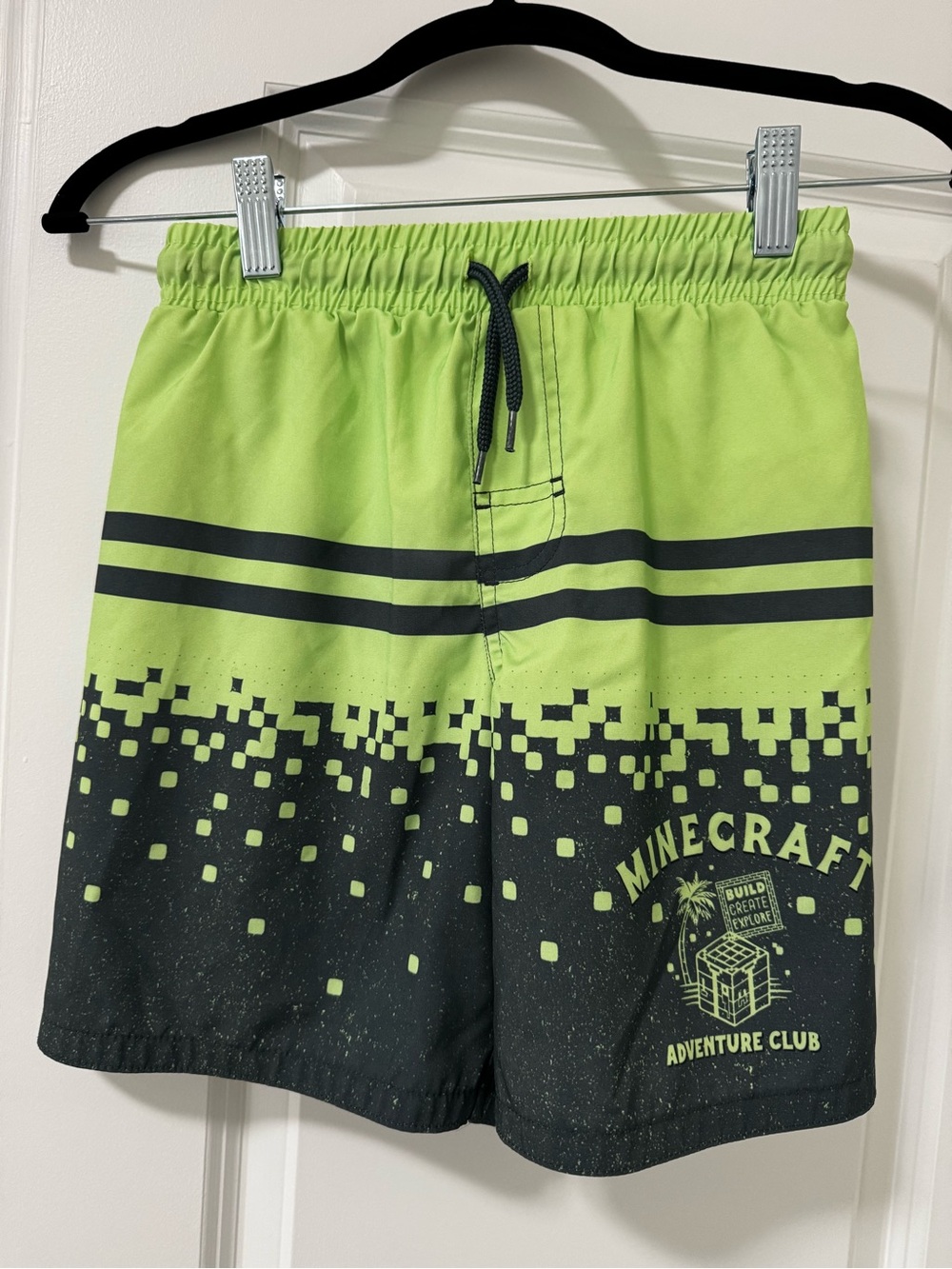 Boy’s  Lime Green and Black Adventure Club Swim Shorts. Good condition.